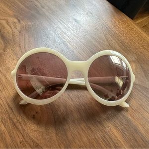 Brian Atwood circle sunglasses.